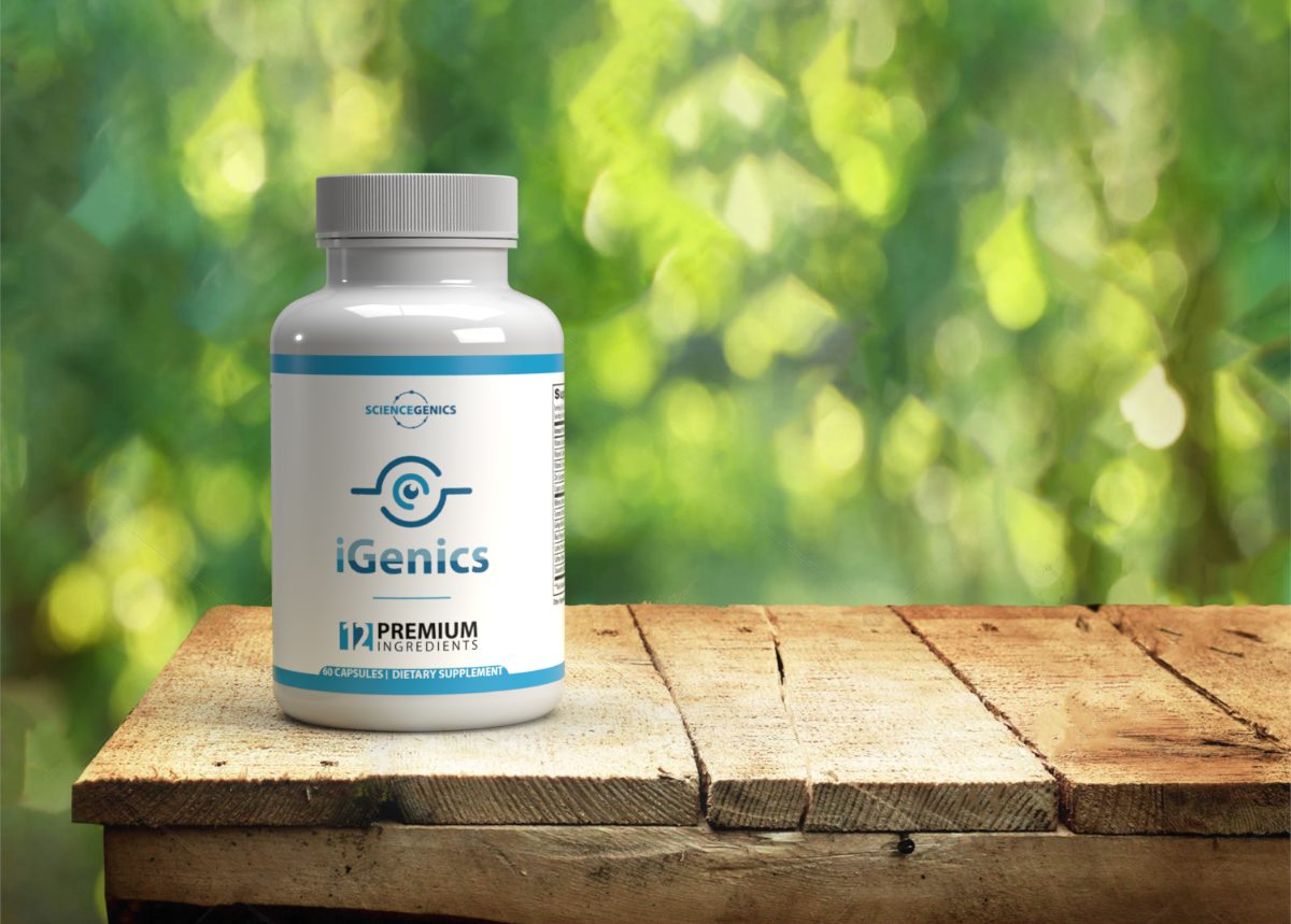 A bottle of iGenics on a wooden table outdoors